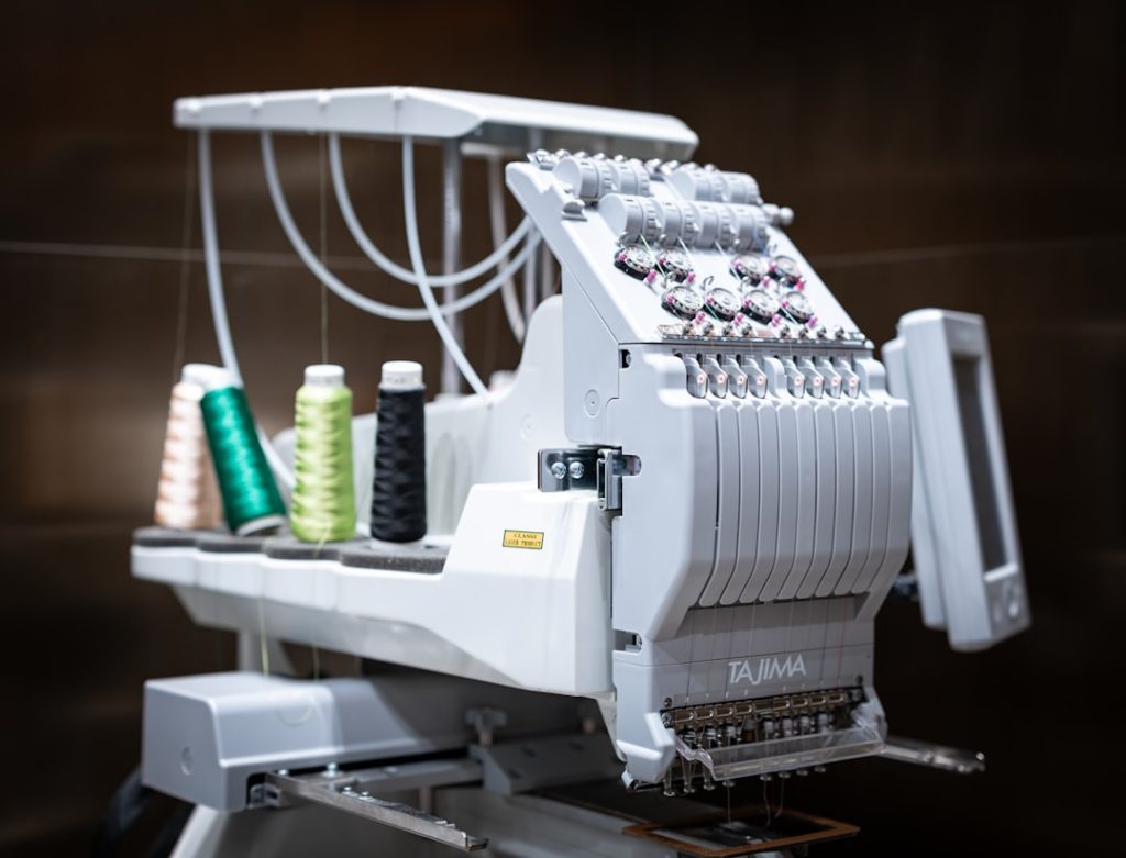 a-close-up-of-a-machine-with-some-thread-on-it-cqr2x2aliza
